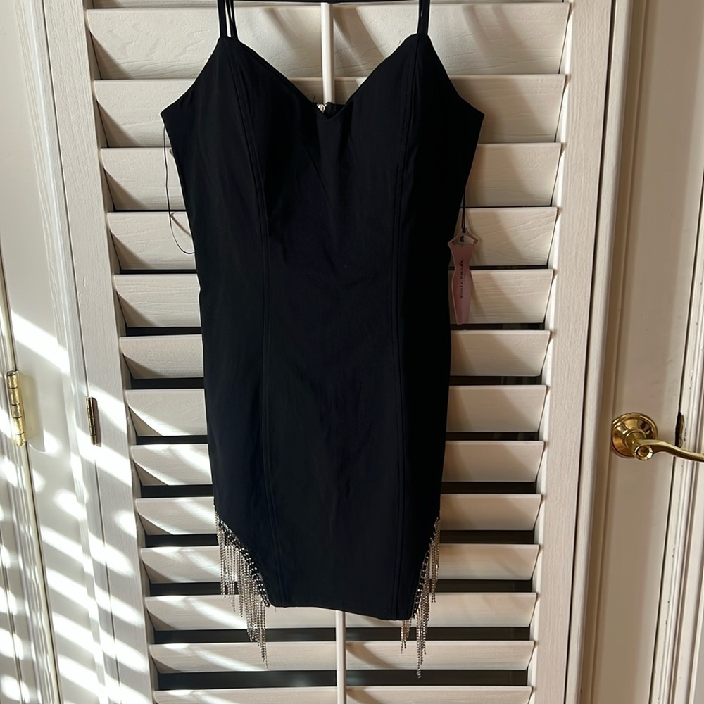 Black dress with sparkly fringe on both sides, size medium, never worn